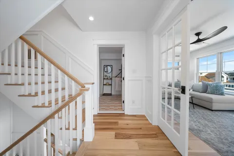 a view of a livingroom with furniture and stairs