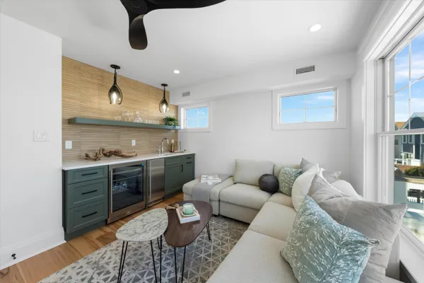 a living room with furniture and a window