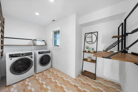 a view of a storage & utility room with washer and dryer