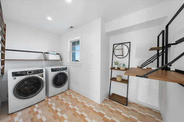 a view of a storage & utility room with washer and dryer