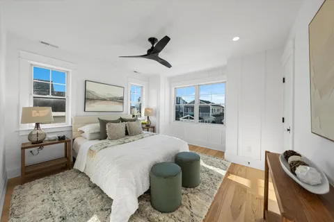 a bedroom with a bed and a couch