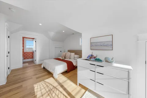 a bedroom with a bed and a dresser