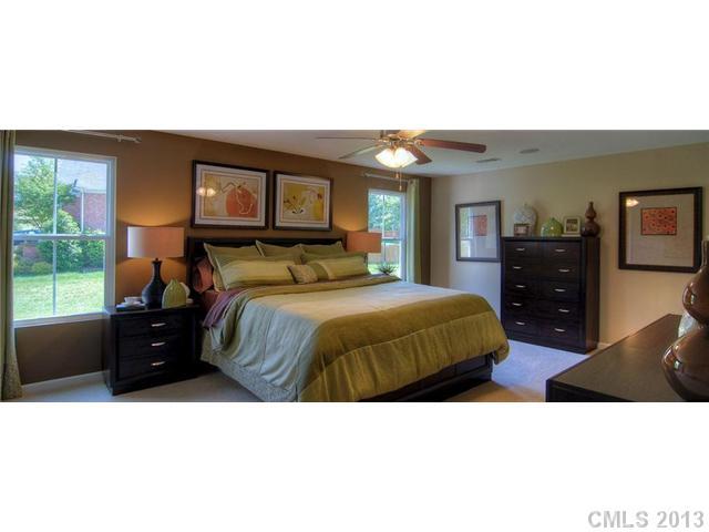 3003 Fallondale Road, Unit 855 Waxhaw, NC 28173 - Photo 2 of 2 a bedroom with a bed and a dresser