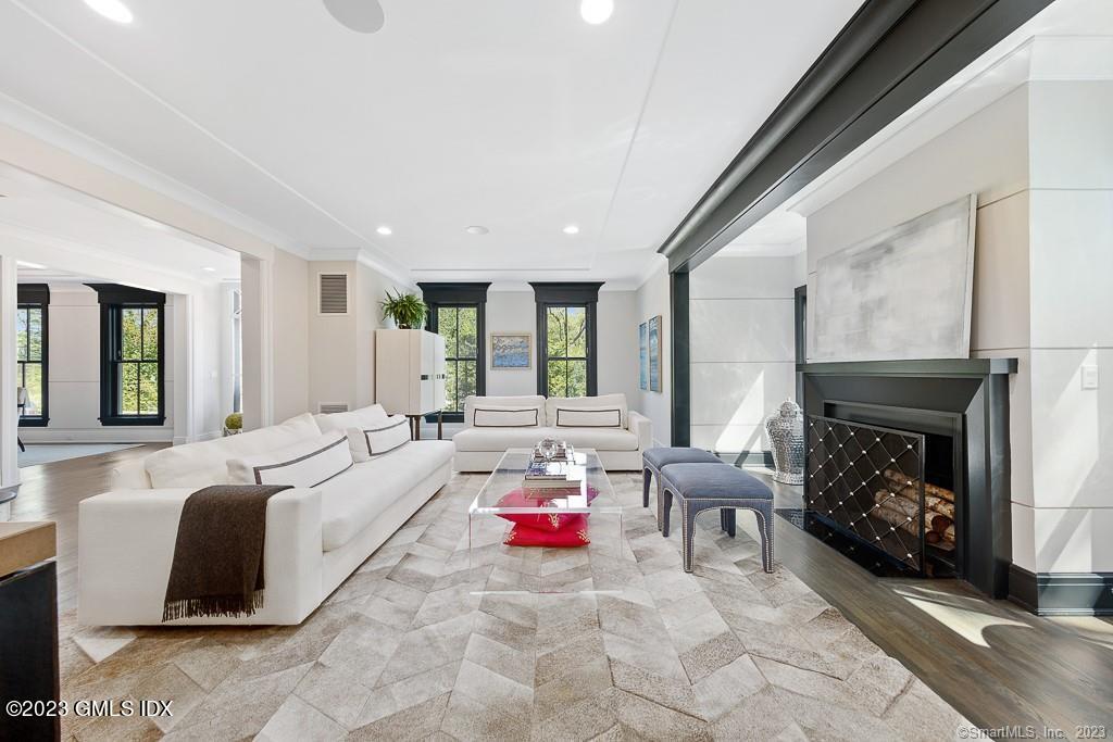 8 S Trail Darien, CT 06820 - Photo 13 of 38 a living room with furniture and a fireplace