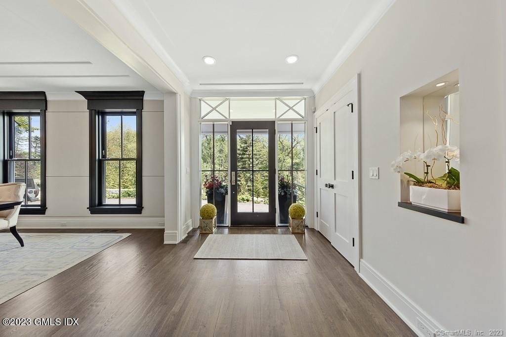 8 S Trail Darien, CT 06820 - Photo 17 of 38 a view of an entryway with wooden floor and windows