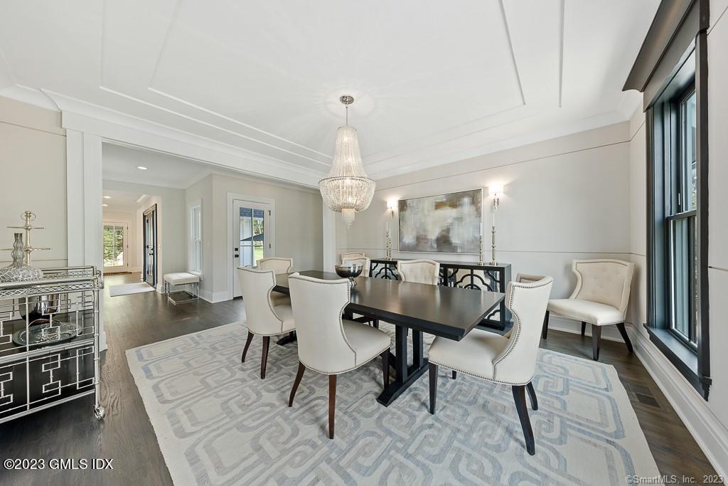 8 S Trail Darien, CT 06820 - Photo 18 of 38 a view of a a dining room with furniture window and wooden floor