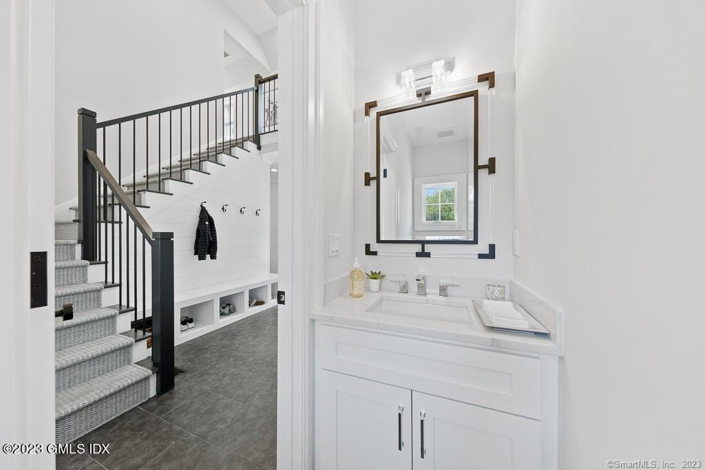 8 S Trail Darien, CT 06820 - Photo 21 of 38 a bathroom with a sink and a mirror
