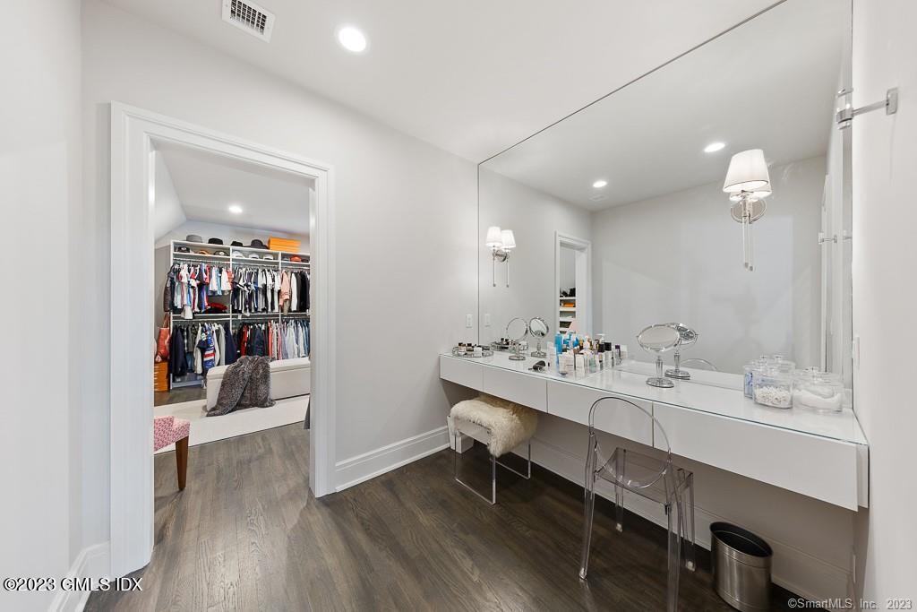 8 S Trail Darien, CT 06820 - Photo 27 of 38 a bathroom with a sink double vanity and a mirror