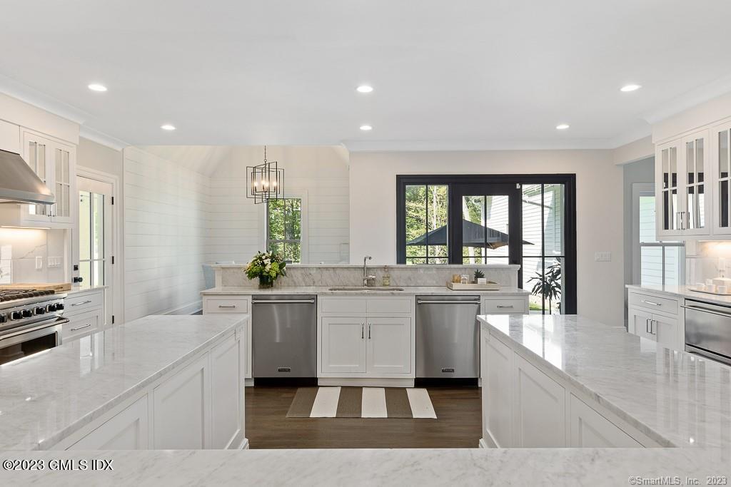 8 S Trail Darien, CT 06820 - Photo 6 of 38 a large white kitchen with a large window