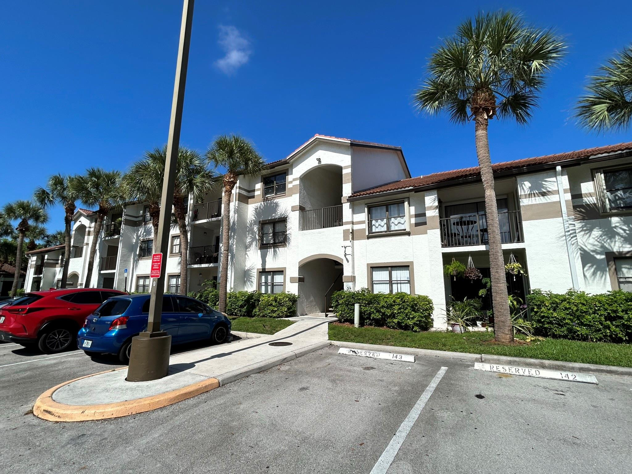 570 South Park Road, Unit 236 Hollywood, FL 33021 - Photo 31 of 36 a view of a house with street that has plants and palm trees