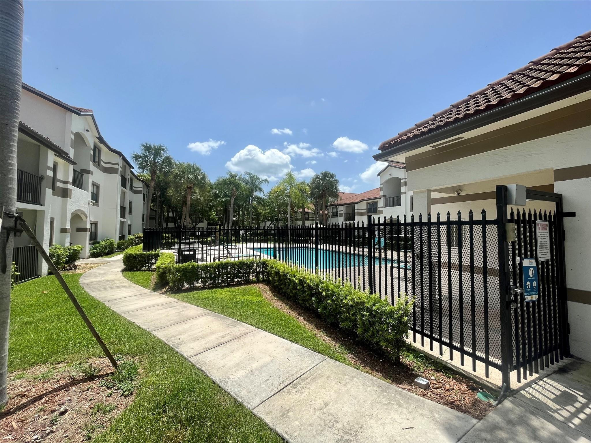 570 South Park Road, Unit 236 Hollywood, FL 33021 - Photo 36 of 36 a view of a swimming pool with a garden
