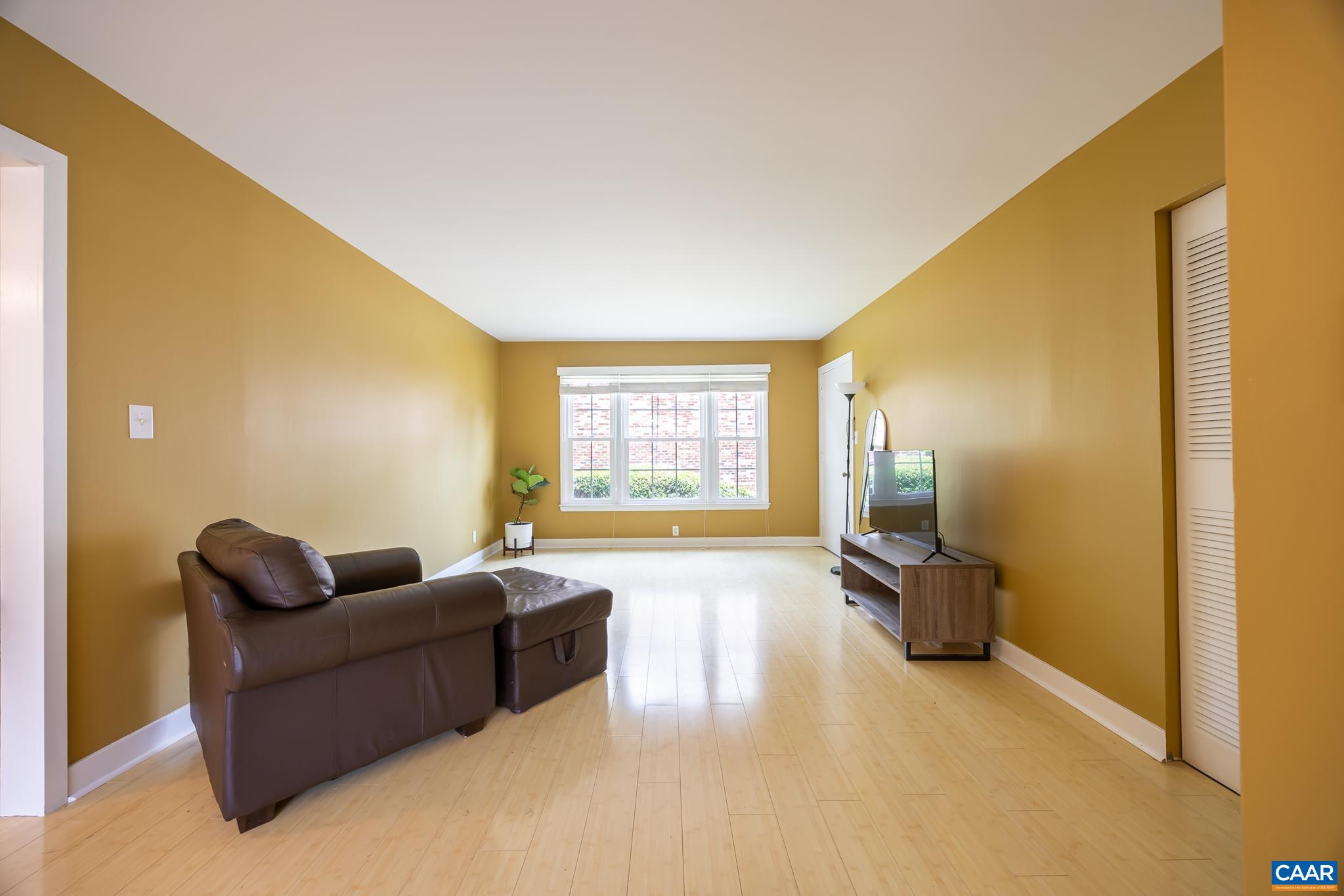 2527 Hydraulic Road, Unit 41 Charlottesville, VA 22901 - Photo 11 of 16 a living room with furniture and a flat screen tv