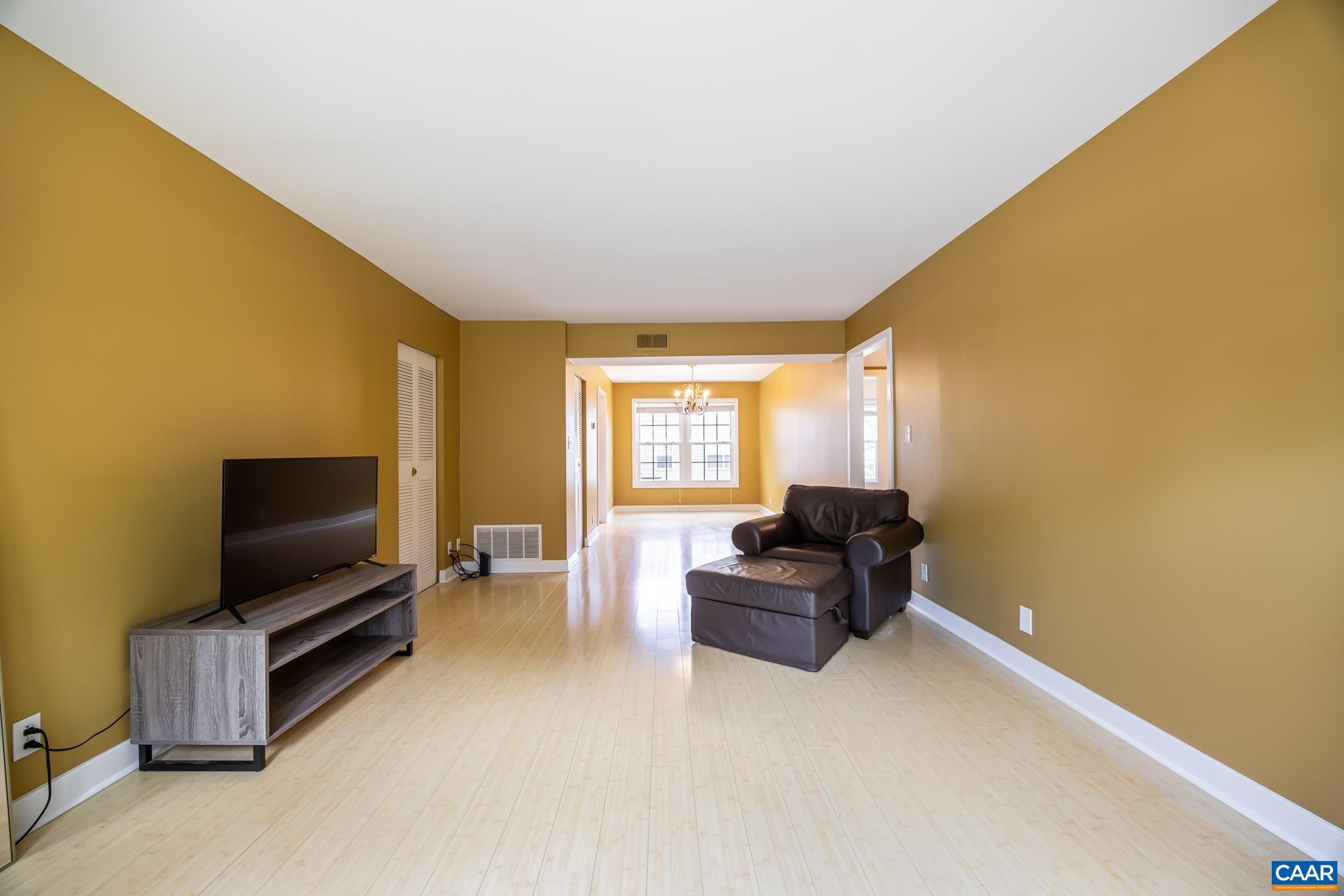 2527 Hydraulic Road, Unit 41 Charlottesville, VA 22901 - Photo 6 of 16 a living room with couch and a flat screen tv