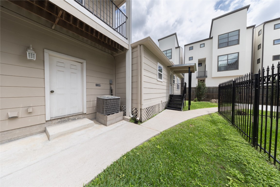 1229 West 21st Street Houston, TX 77008 - Photo 24 of 25 a view of a house with a yard and stairs