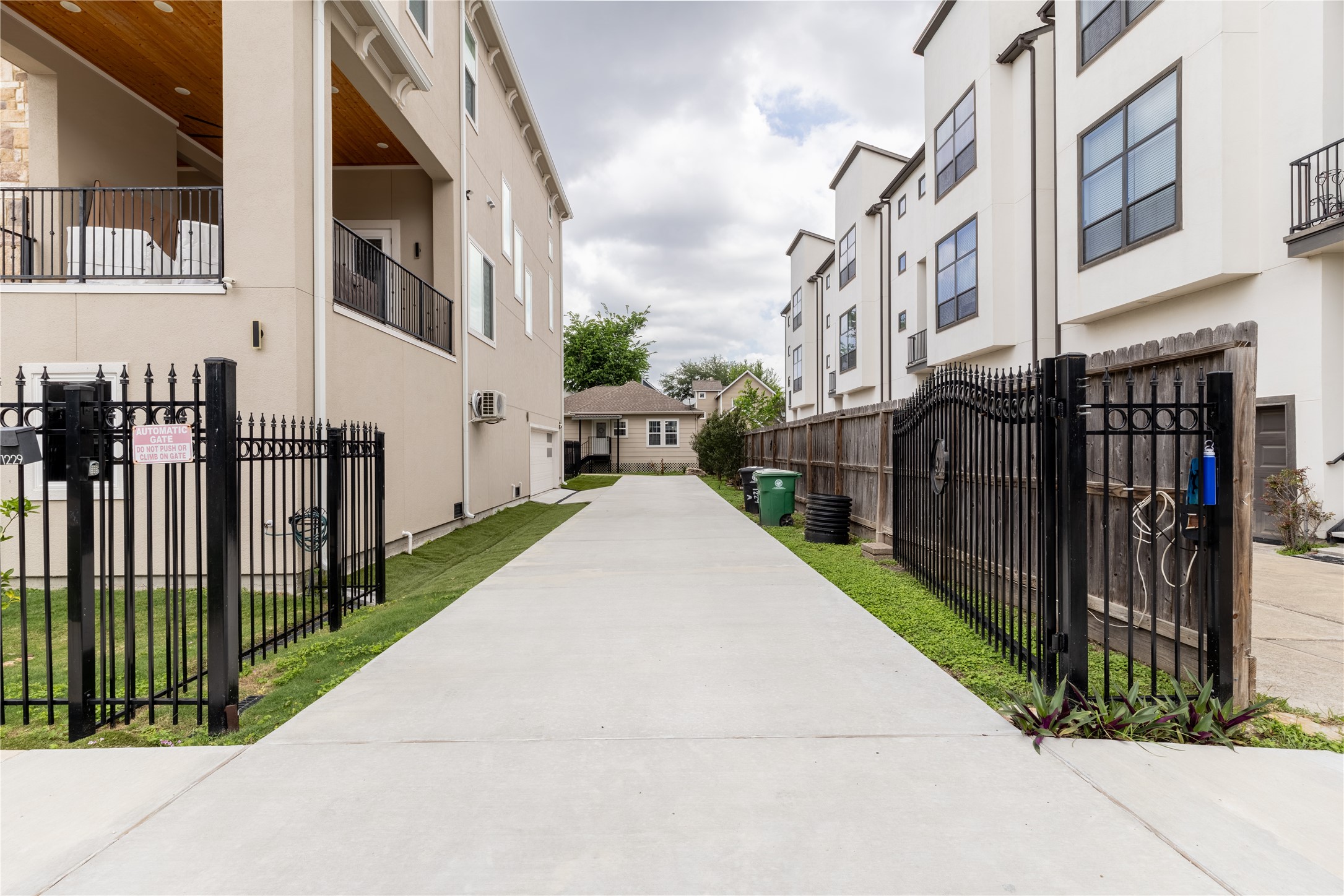 1229 West 21st Street Houston, TX 77008 - Photo 3 of 25 a view of a street with brick building in the background