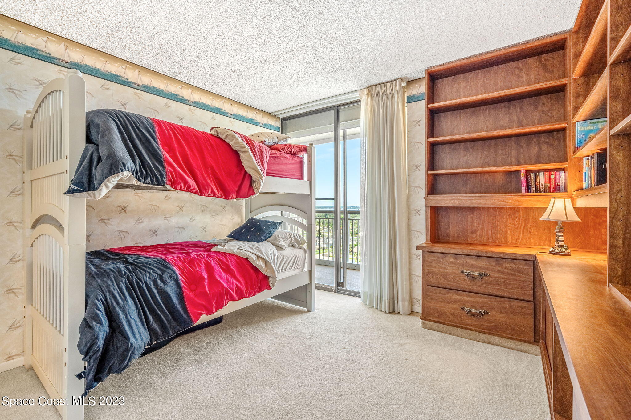 877 N Highway, Unit 1304 Indialantic, FL 32903 - Photo 11 of 24 a view of a bedroom with a couch and closet