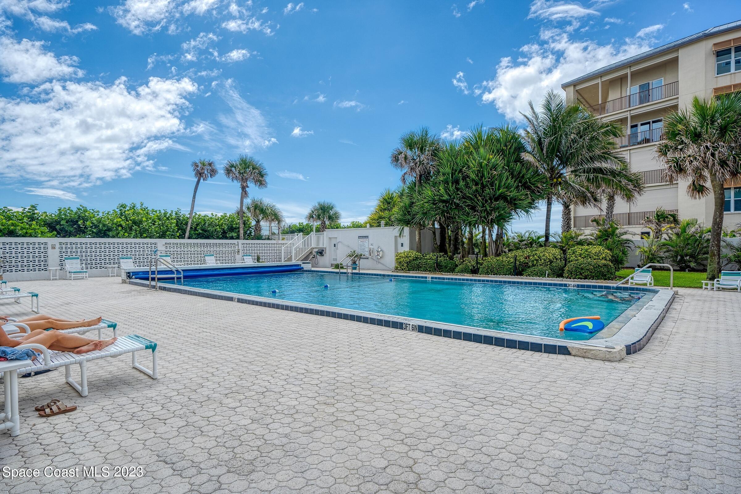 877 N Highway, Unit 1304 Indialantic, FL 32903 - Photo 17 of 24 a view of swimming pool with a yard and sitting area