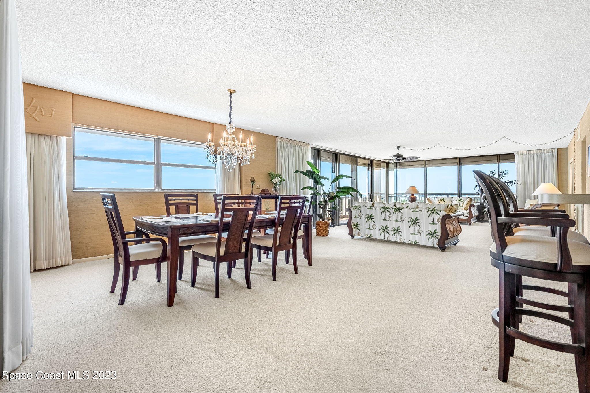 877 N Highway, Unit 1304 Indialantic, FL 32903 - Photo 3 of 24 a dining area with furniture and a table