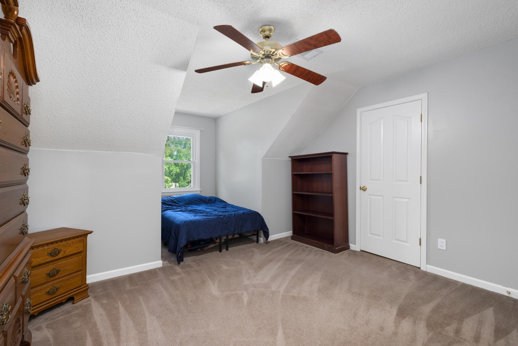 8539 Campground Road Drummonds, TN 38023 - Photo 31 of 38 a bedroom with a bed and a ceiling fan