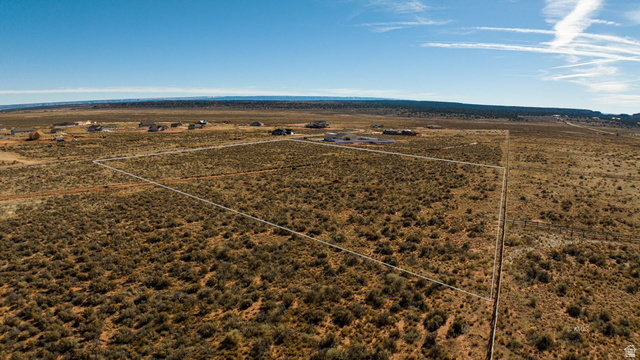 11 Crimson Road East, Unit 11 Kanab, UT 84741 - Photo 17 of 21 Aerial view of sparsely populated area featuring a desert landscape