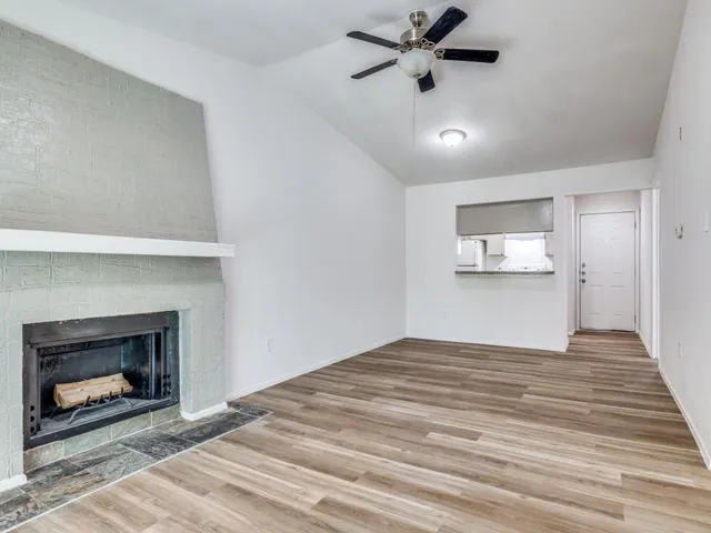 a bedroom with a bed and a fireplace