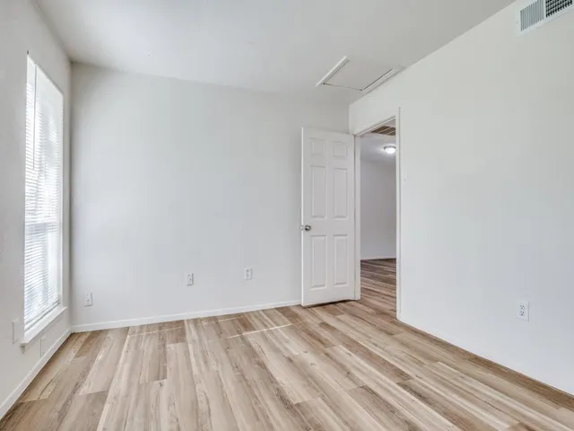 a view of an empty room and window