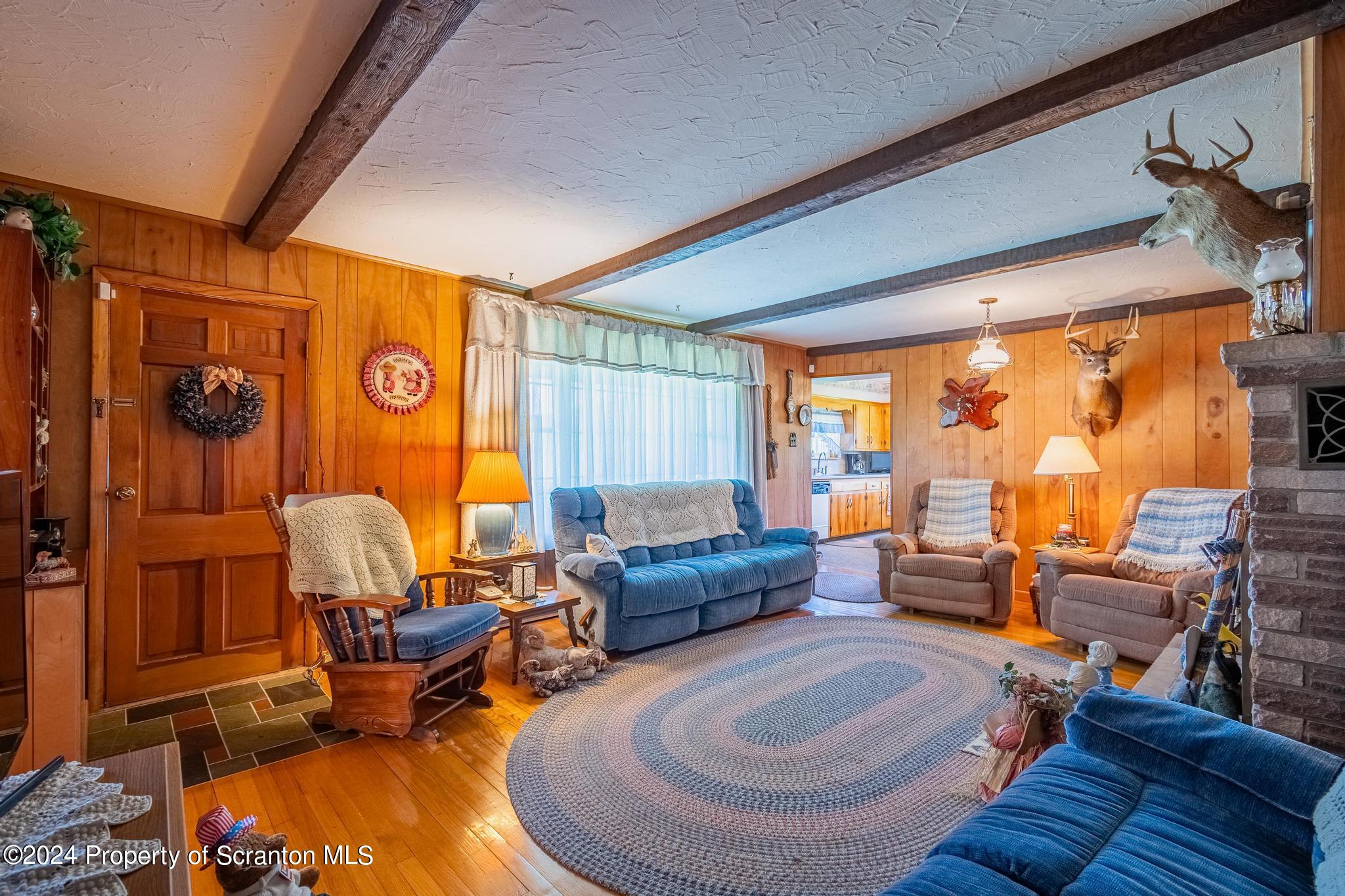 520 State Rte 2010 Forest City, PA 18421 - Photo 21 of 99 a living room with furniture and a large window