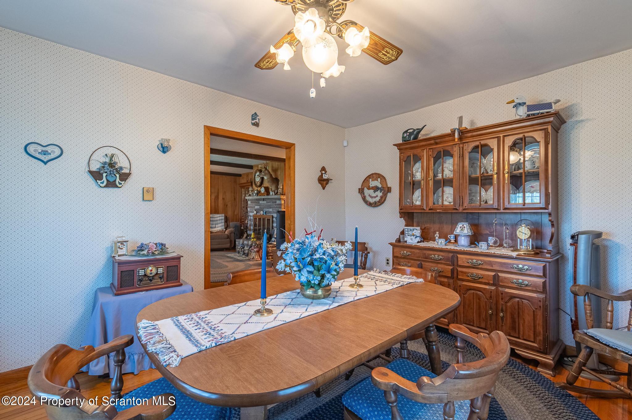 520 State Rte 2010 Forest City, PA 18421 - Photo 24 of 99 a view of a dining room with furniture a chandelier and wooden floor