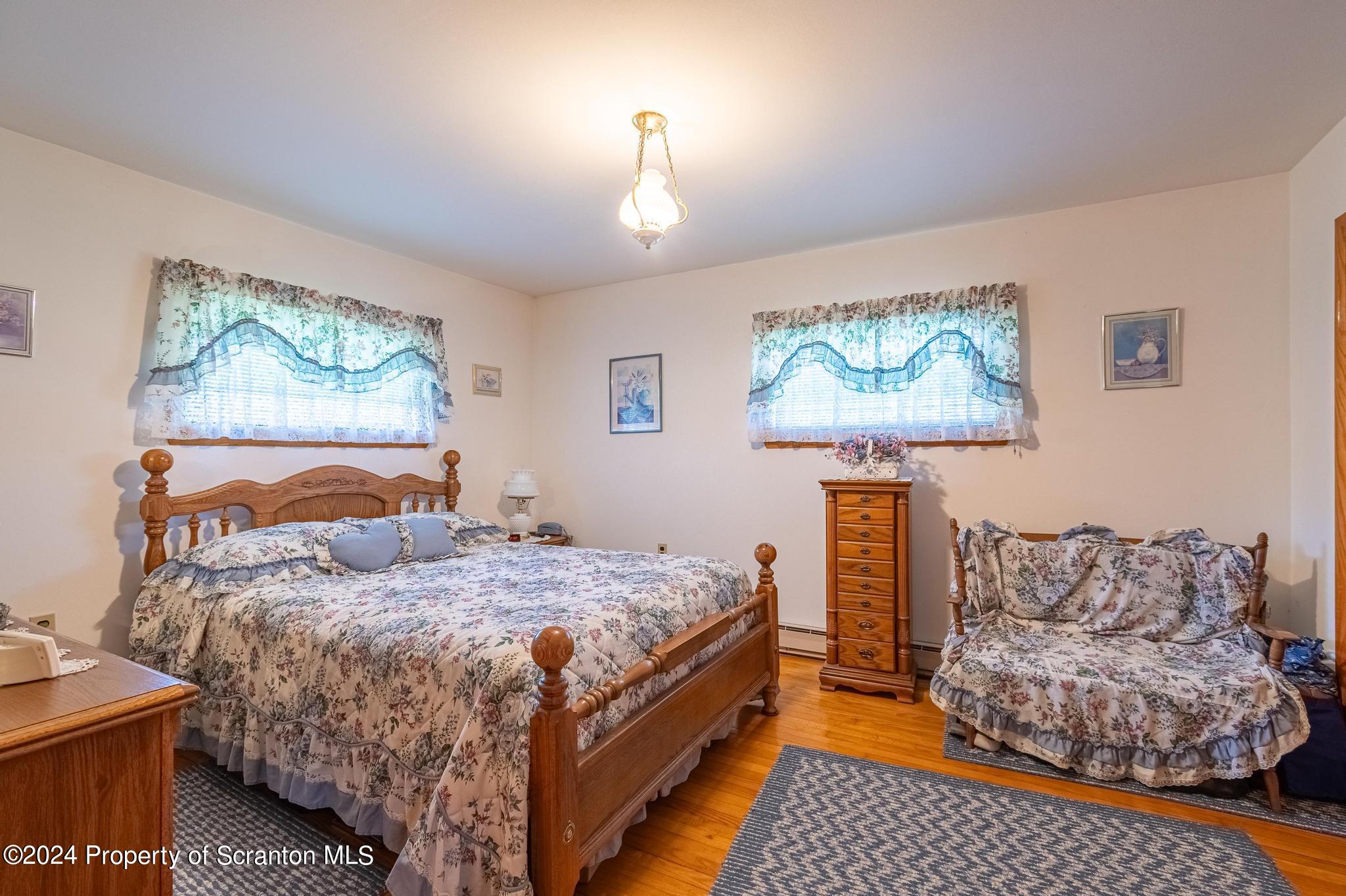 520 State Rte 2010 Forest City, PA 18421 - Photo 26 of 99 a bedroom with a bed and a painting on the wall