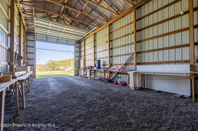 a view of a big yard with large trees
