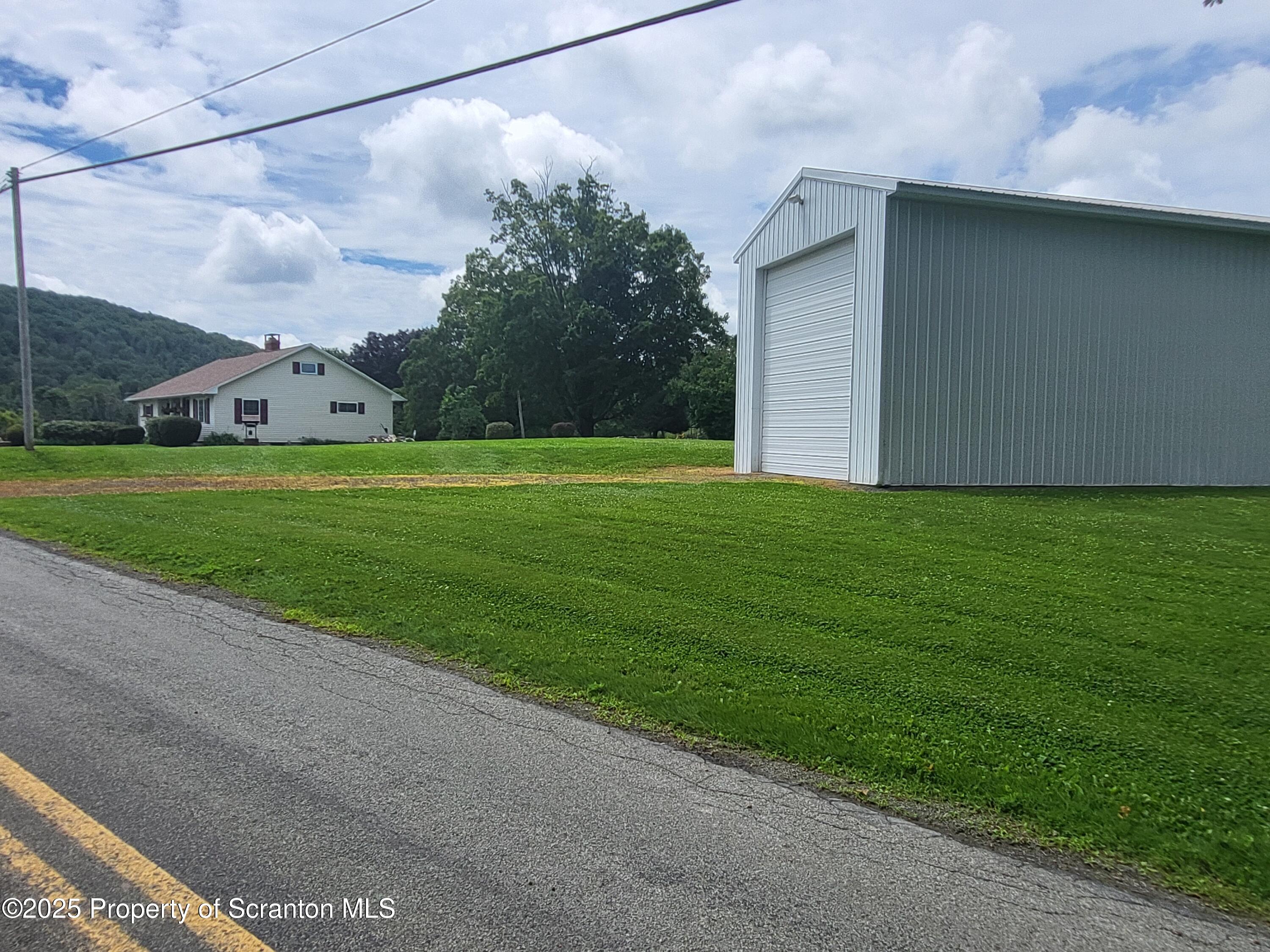 520 State Rte 2010 Forest City, PA 18421 - Photo 97 of 99 a view of a big house with a big yard and large trees