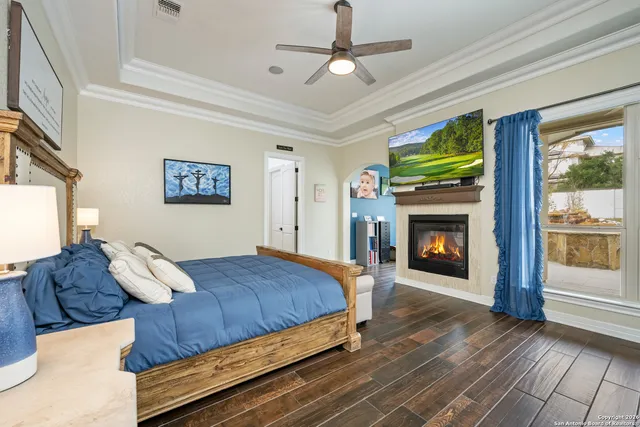 a bedroom with a bed and a fireplace