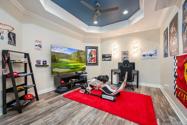a living room with furniture a flat screen tv and a large window
