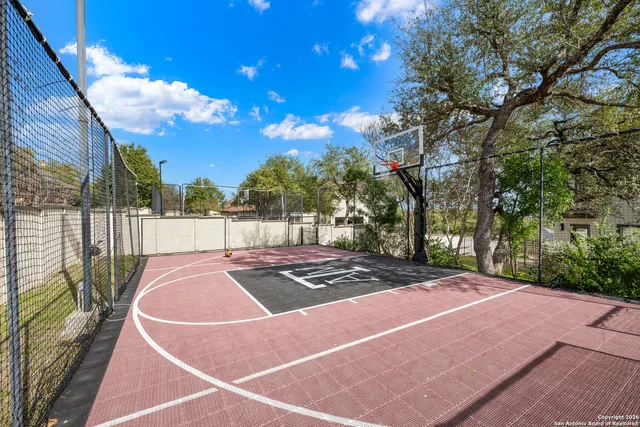 a view of outdoor space and basketball court