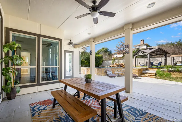 a balcony with furniture and wooden floor