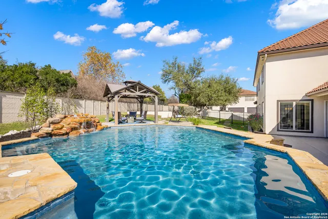 a view of swimming pool with outdoor seating