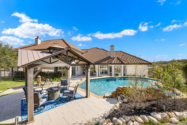 a front view of a house with garden yard and deck