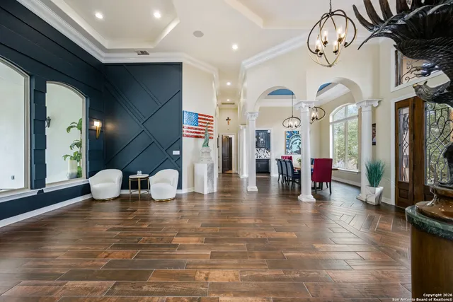a view of an entryway with wooden floor
