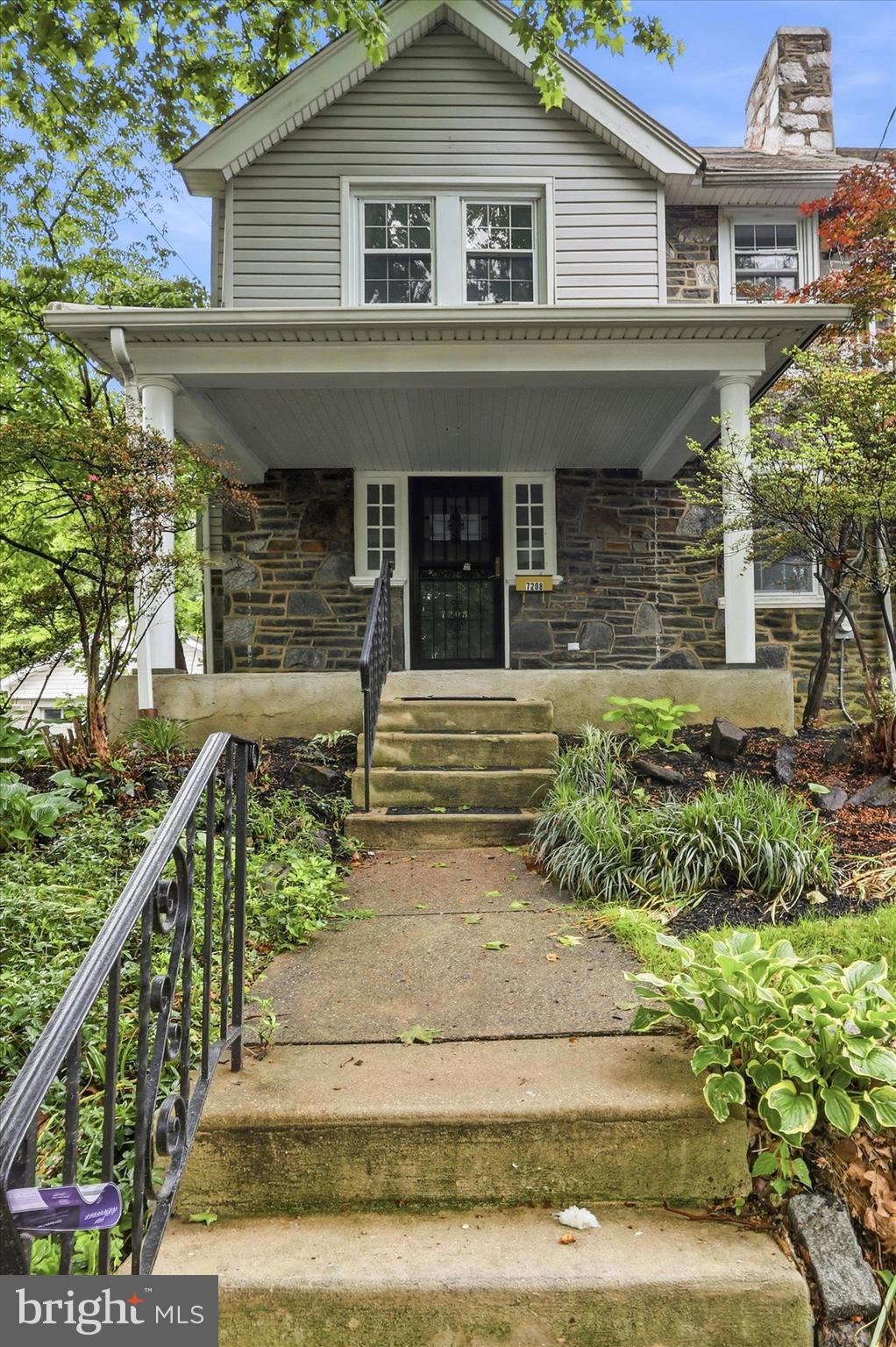 7208 Hilltop Road Upper Darby, PA 19082 - Photo 3 of 28 a front view of a house with garden