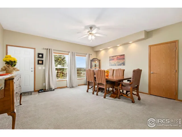 a view of a livingroom with furniture and a window