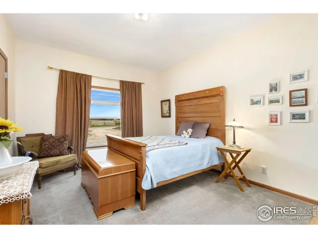 a bedroom with furniture and a window