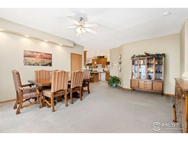 a dining room with furniture and chandelier