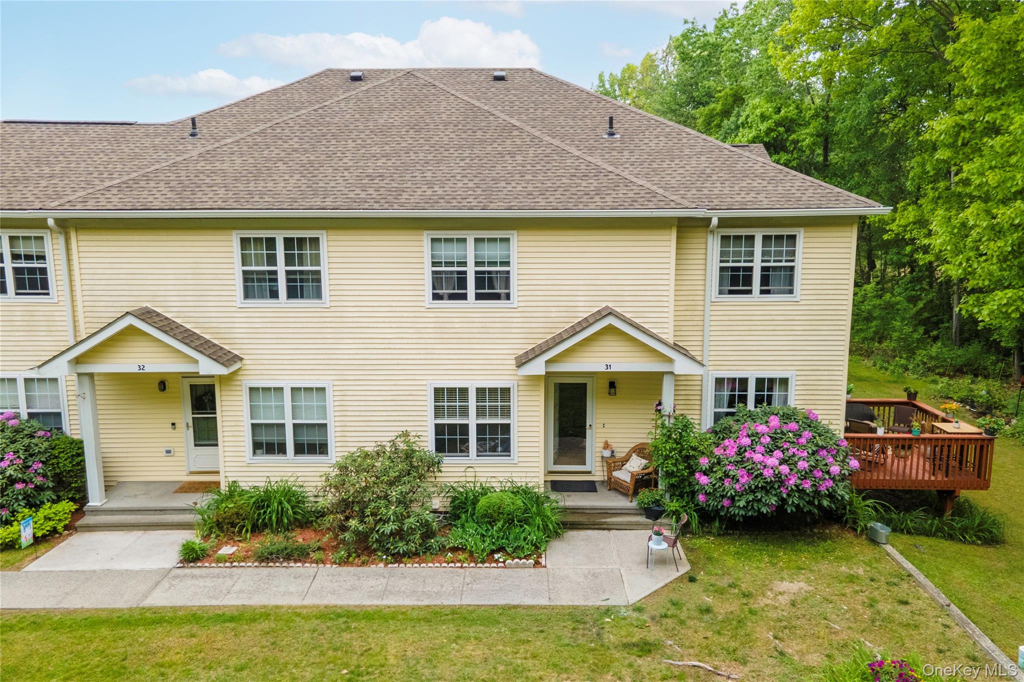 129 Stringham Road, Unit 31 LaGrangeville, NY 12540 - Photo 21 of 26 a front view of a house with garden