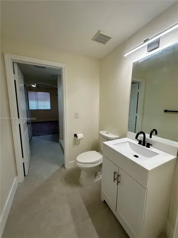 a bathroom with a sink and a toilet