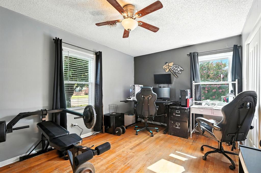 1017 Northwest 2nd Street Hamlin, TX 79520 - Photo 8 of 29 a view of a workspace with furniture and a window