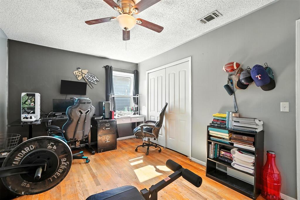1017 Northwest 2nd Street Hamlin, TX 79520 - Photo 9 of 29 a view of a workspace with furniture and a window