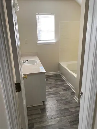 a bathroom with a sink window and shower