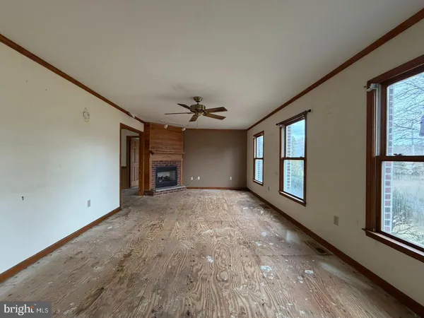 a view of empty room with windows