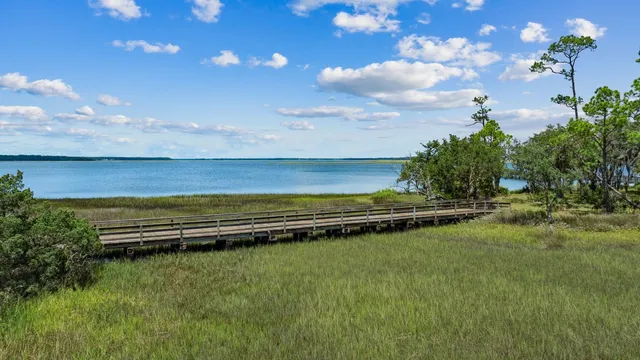 a view of a backyard with wooden fence