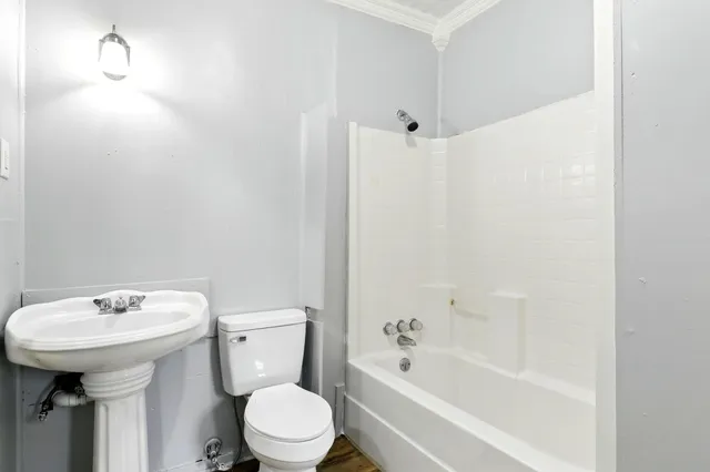 a bathroom with a sink toilet and bathtub